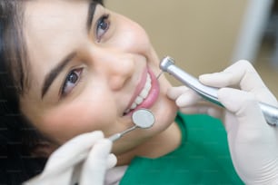 Young woman having teeth examined by dentist in dental clinic, teeth check-up and Healthy teeth concept