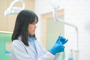 A portrait of female dentist working in dental clinic, teeth check-up and Healthy teeth concept