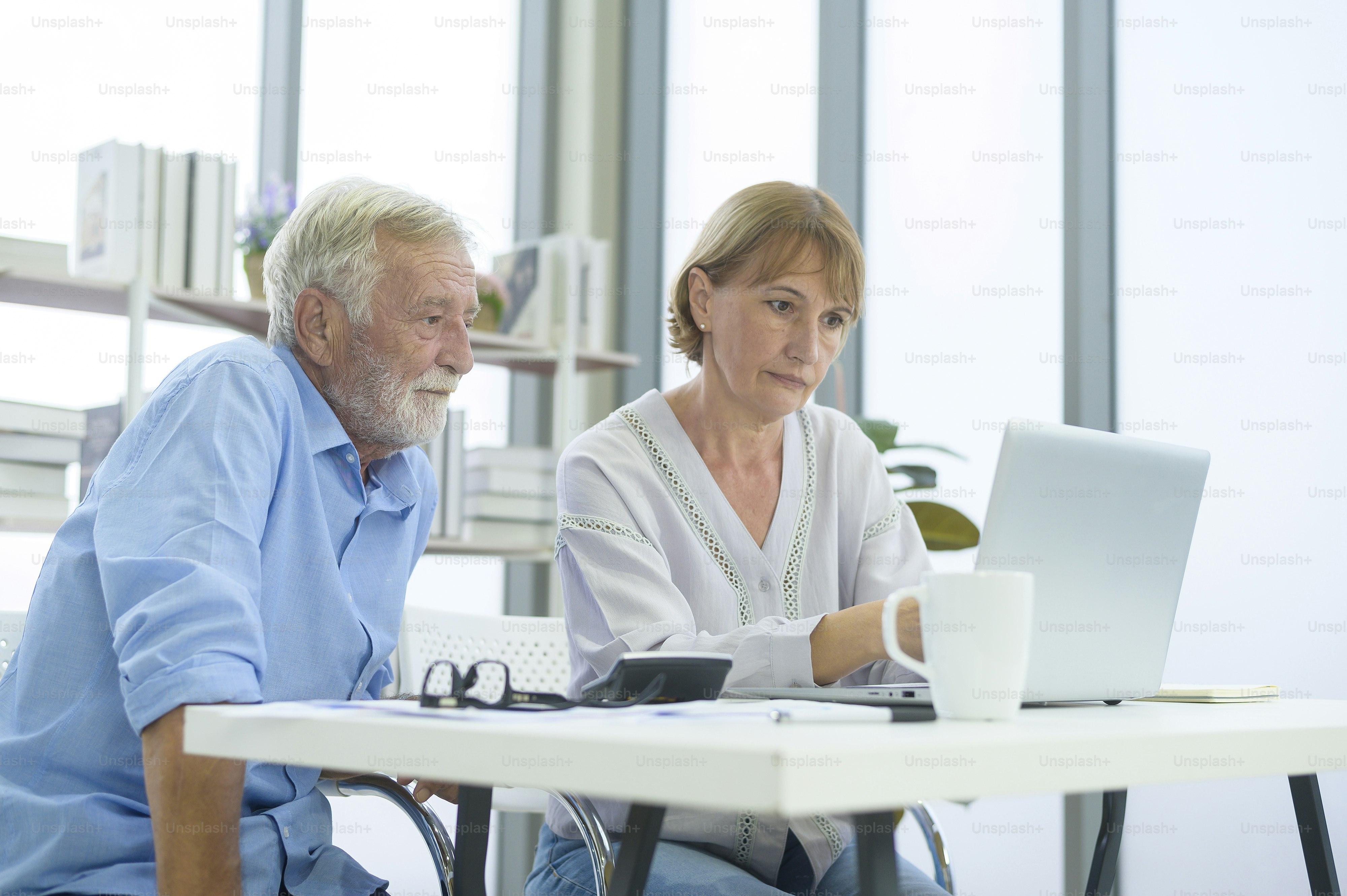 Caucasian senior Business people working and brainstorming in modern office