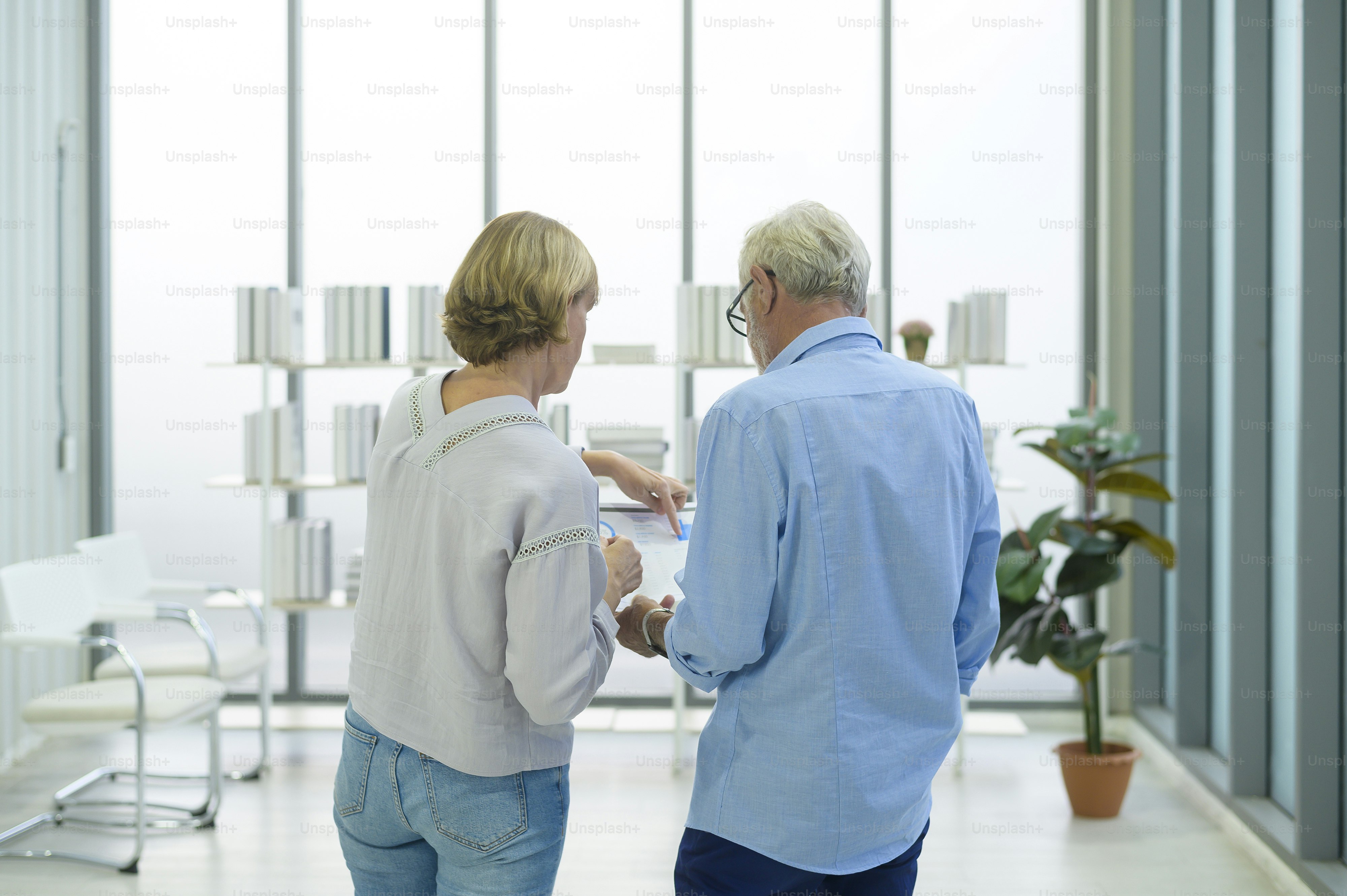 Caucasian senior Business people working and brainstorming in modern office