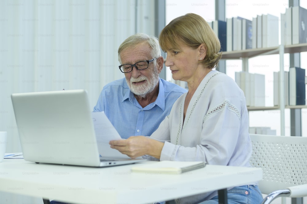 Caucasian senior Business people working and brainstorming in modern office