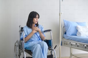 A despondent Asian woman patient. Following the doctor's declaration that the cancer was nearing the end of its course.