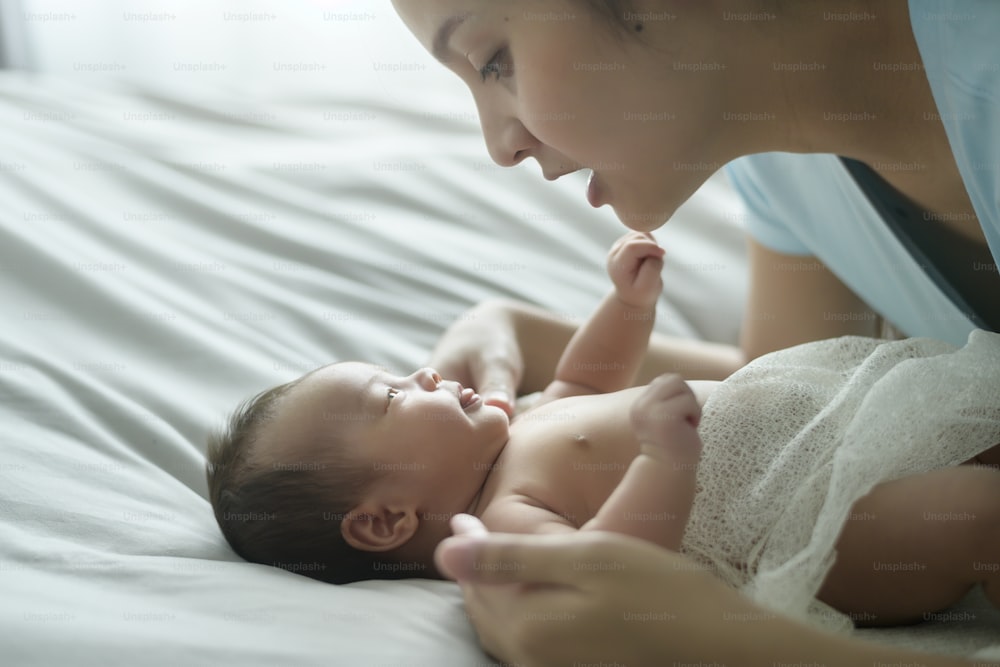 A Young mother with a Cute new born baby.