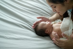 A Young mother with a Cute new born baby.