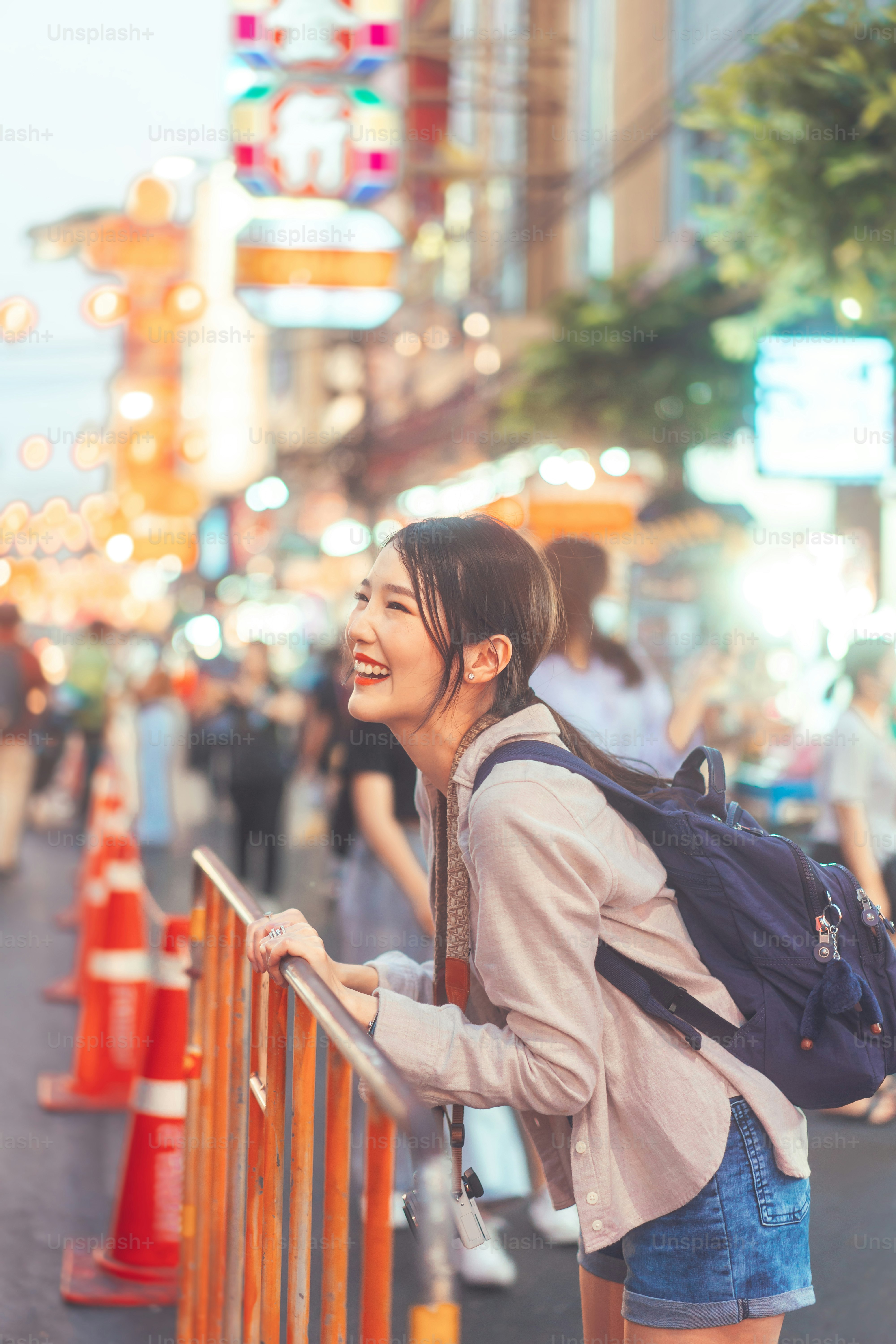 Walking young adult asian woman traveller backpack. People traveling in city lifestyle chinatown street food market Bangkok, Thailand. Staycation southeast asia summer trip concept.