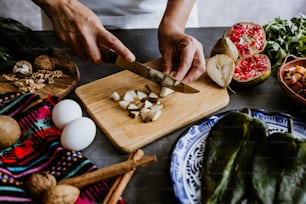 mexican woman cooking chiles en nogada recipe with Poblano chili and ingredients, traditional dish in Puebla Mexico