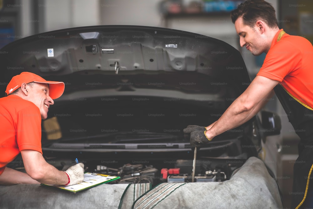 mechanic car service garage center, repairman worker person working for maintenance auto repair the car in vehicle workshop station, automobile transportation service work concept