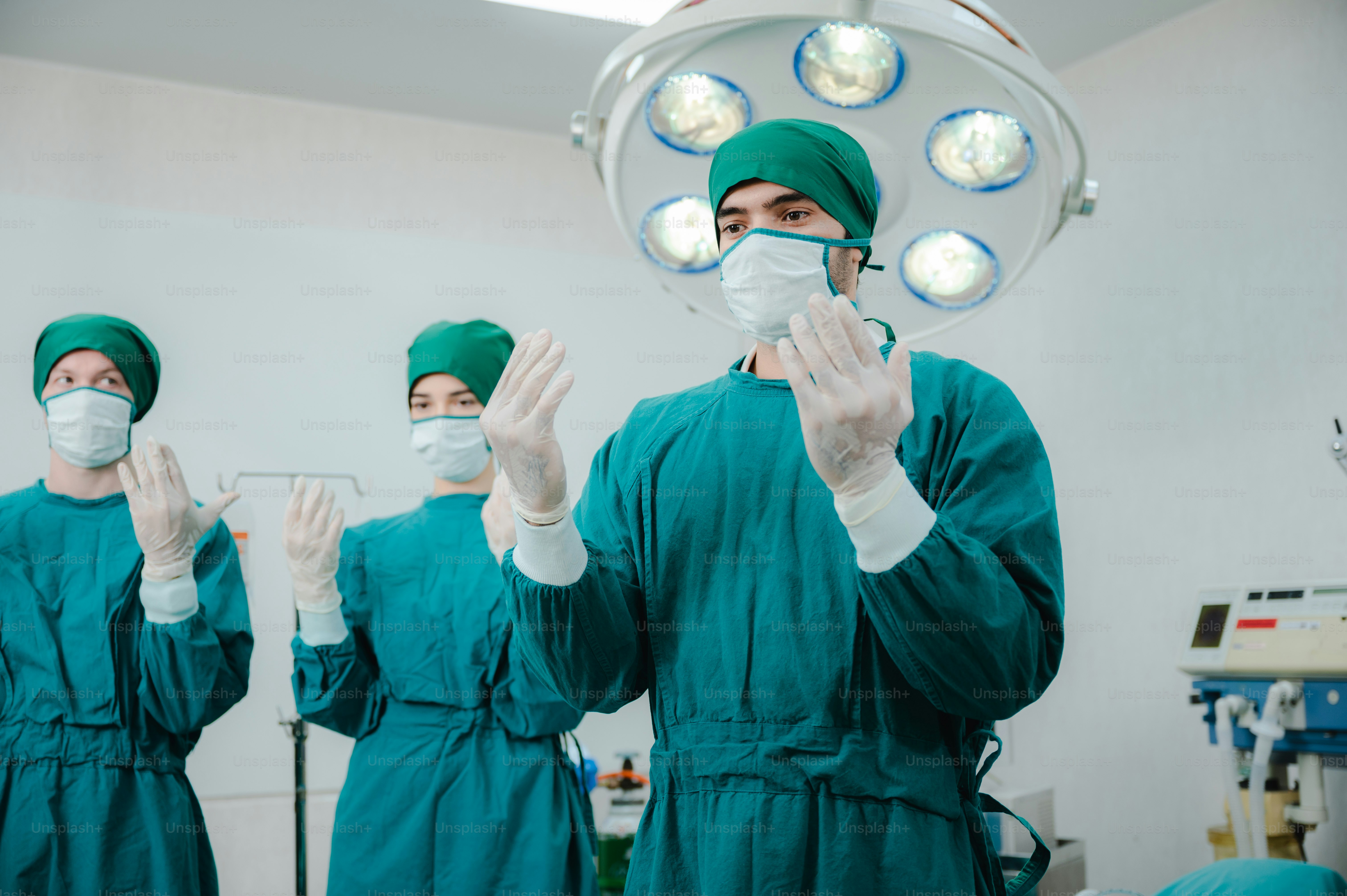 surgical doctor person are wearing protected suit medical operation uniform, medicine specialist in green doctor clinic suit at hospital