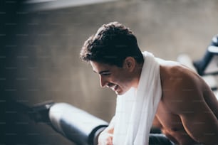 Young men are relaxed from exercise in the gym Along with towels