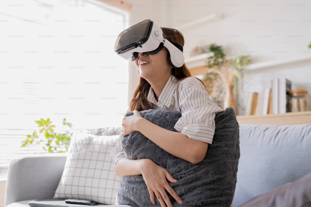 happiness exited asian female teen hand wave along with her virtual concert performance via virtual goggle virtual interactive headset,asia woman stay home innovation technology lifestyle vr at home