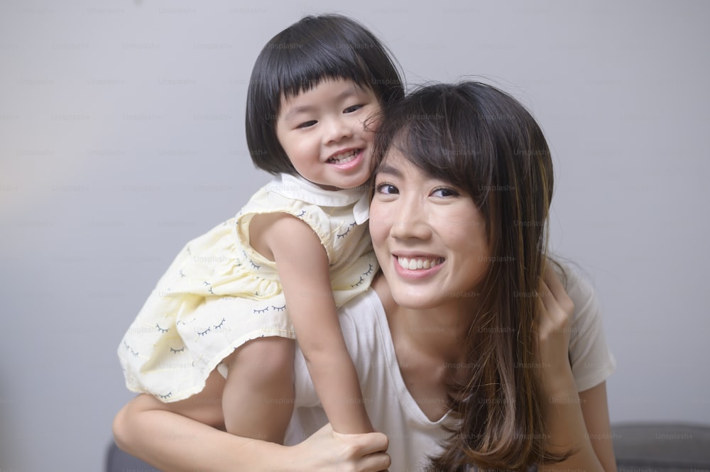A portrait of happy asian mom and daughter