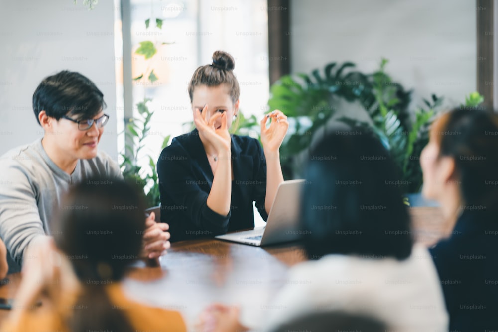 Business coworkers discussing new ideas and brainstorming in a modern office