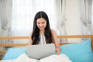 Young business woman working online shopping at her home