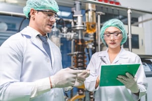 scientist checking on organic cannabis hemp plants in a weed greenhouse. Concept of legalization herbal for alternative medicine with CBD oil, commercial Pharmaceptical medicine business industry