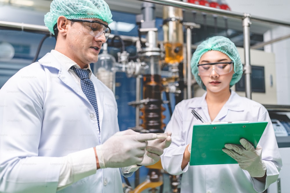 scientist checking on organic cannabis hemp plants in a weed greenhouse. Concept of legalization herbal for alternative medicine with CBD oil, commercial Pharmaceptical medicine business industry