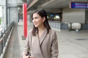 A portrait of beautiful smiling Businesswoman in modern City , people lifestyle concept