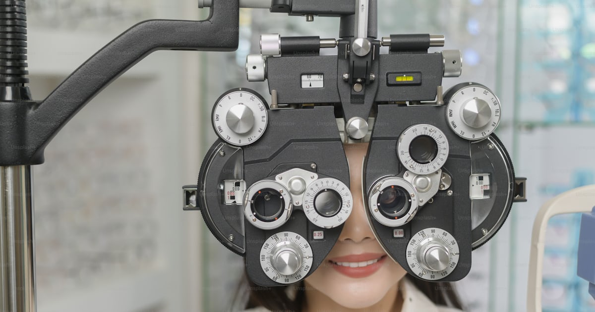 A Young female customer being examined visual test using Bifocal ...