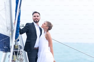 Business couples are celebrating in a yacht, Honeymoon summer trip