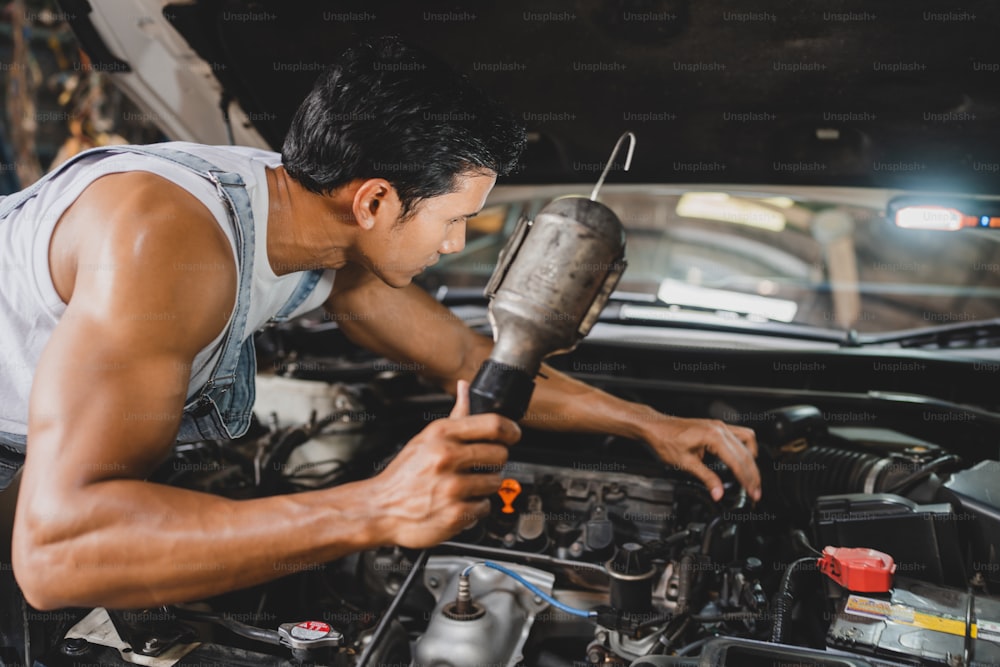 mechanic working and check about auto car engine service, inspection technician having automotive job to maintenance or repair automobile in motor garage, business industrial auto car engine