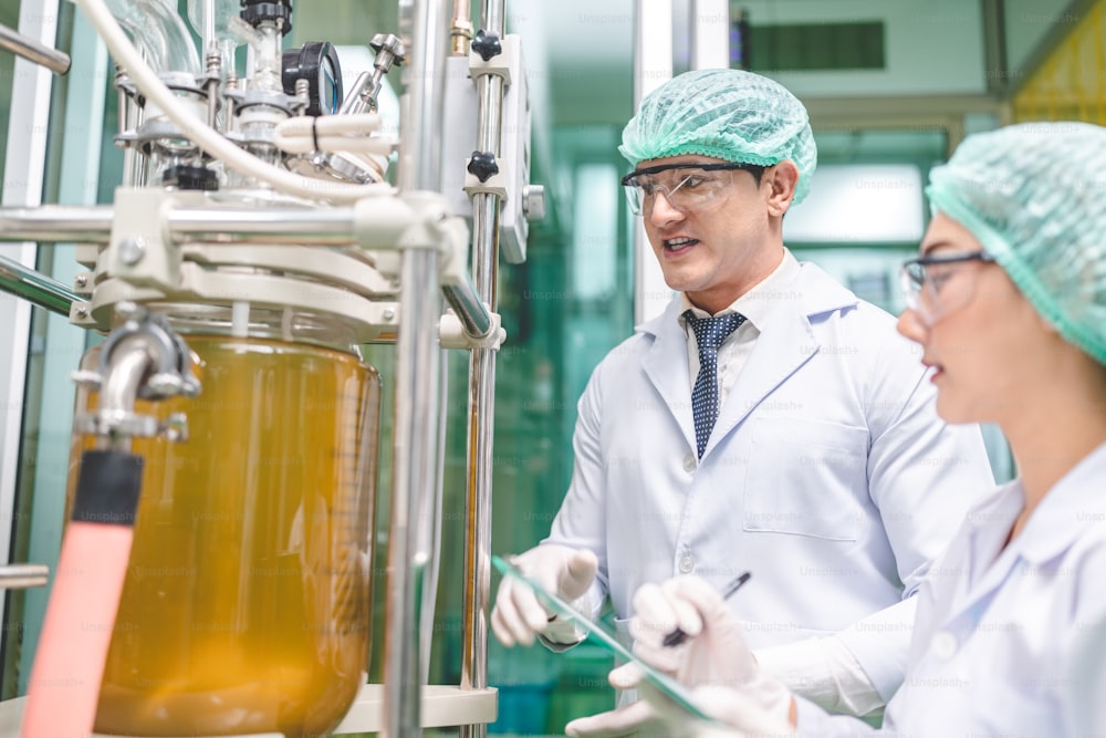 scientist checking on organic cannabis hemp plants in a weed greenhouse. Concept of legalization herbal for alternative medicine with CBD oil, commercial Pharmaceptical medicine business industry