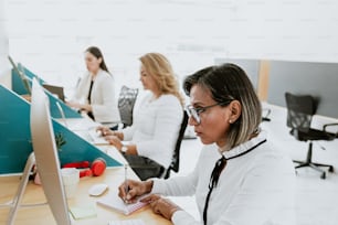 transgender latin woman working with computer at the office in Mexico Latin America