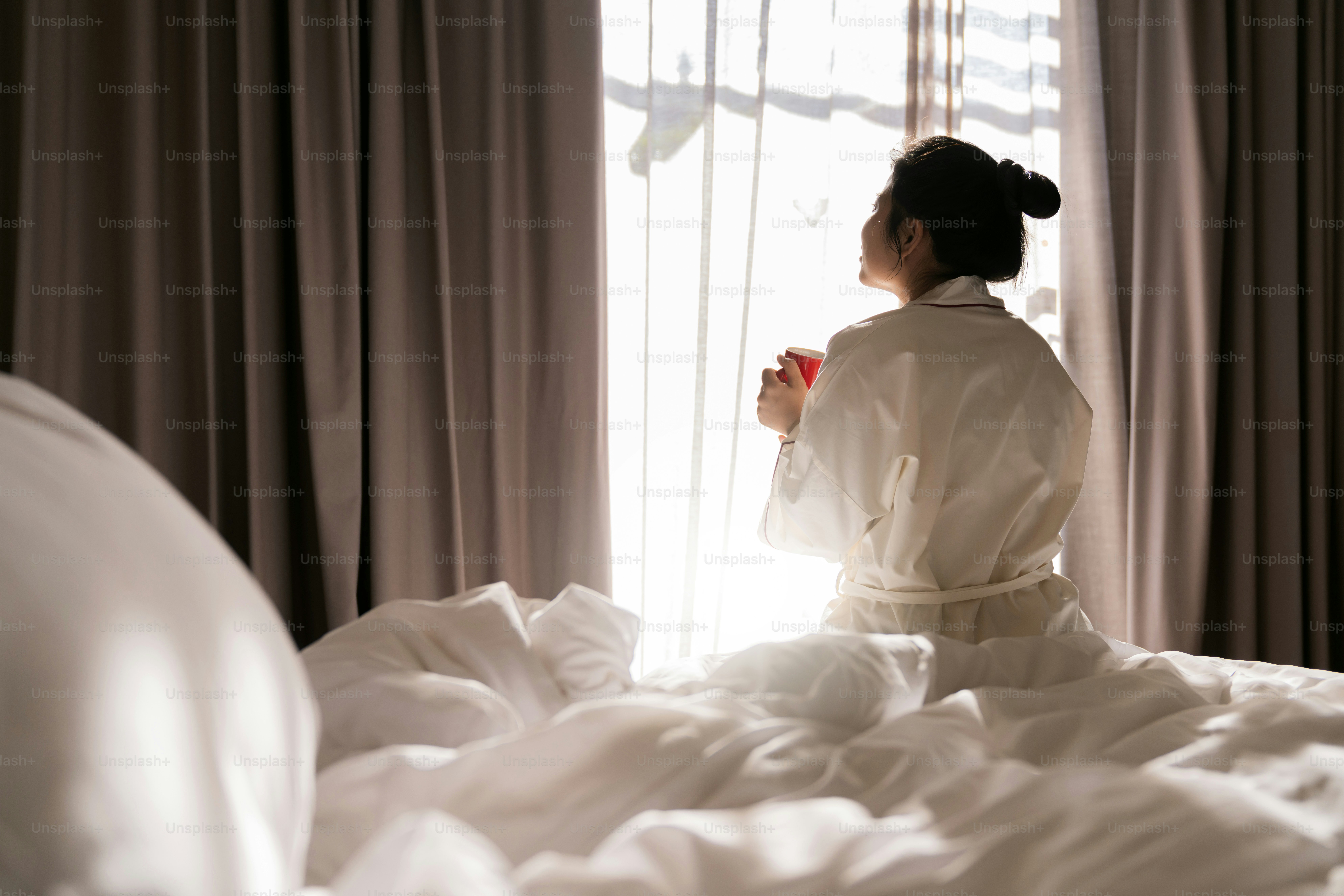 Cheerful tender asain adult female in white casual cloth sitting with