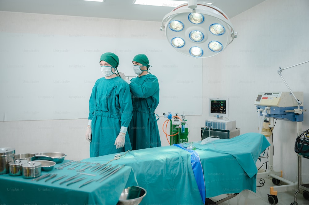 surgical doctor person are wearing protected suit medical operation uniform, medicine specialist in green doctor clinic suit at hospital