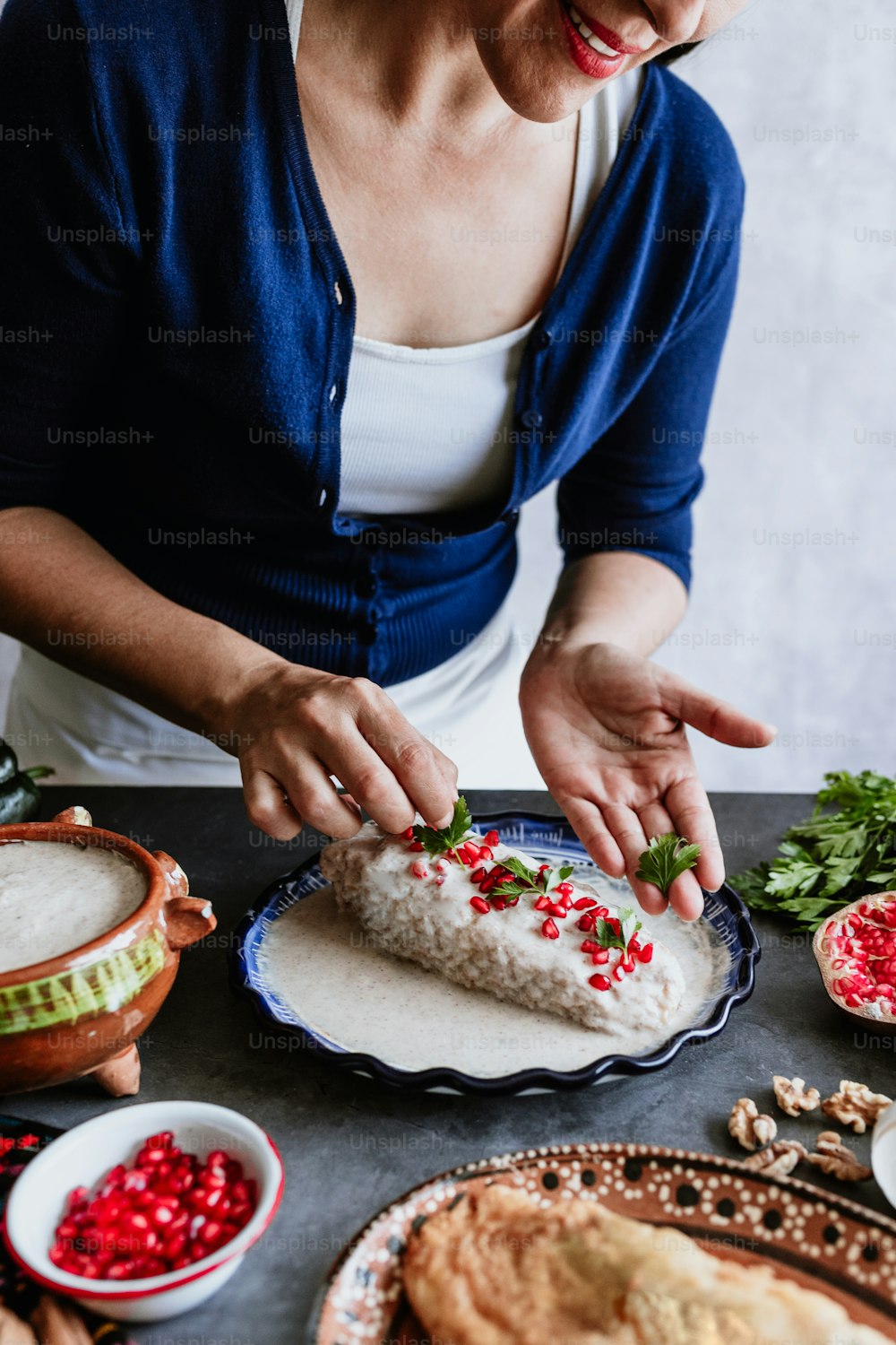 mexican woman cooking chiles en nogada recipe with Poblano chili and ingredients, traditional dish in Puebla Mexico