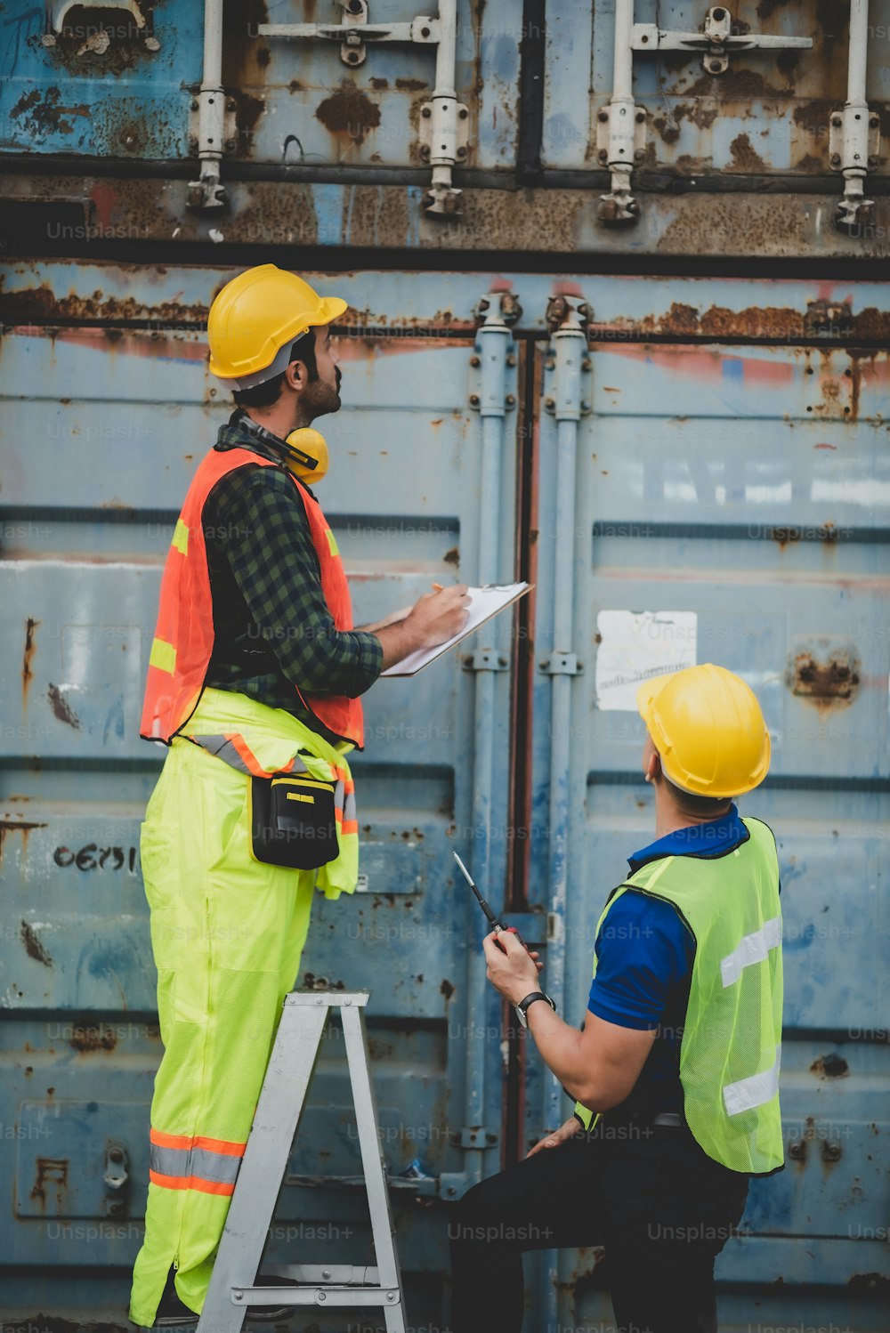 worker teamwork and partner of foreman, engineer, and businessman working in an international shipping area, concept of business industrial and working in container yard"t