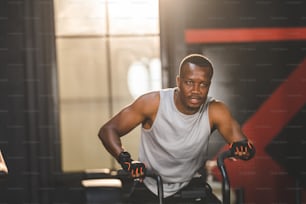 strong athlete caucasian man person exercising in the sport gym, workout exercise training in modern fitness studio for body muscle to fit and slim, heavy bodybuilding and healthy lifestyle people