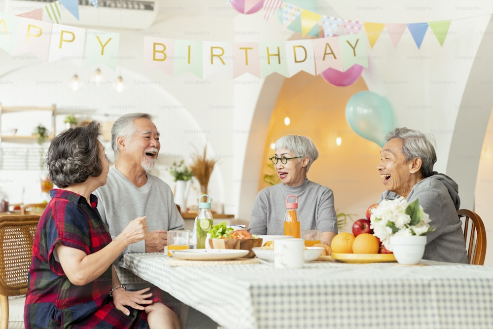 birthday party at senior daycare,group of asian female elder male female laugh smile positive conversation greeting in birthday friend party at nursing home senior daycare center Senior woman birthday