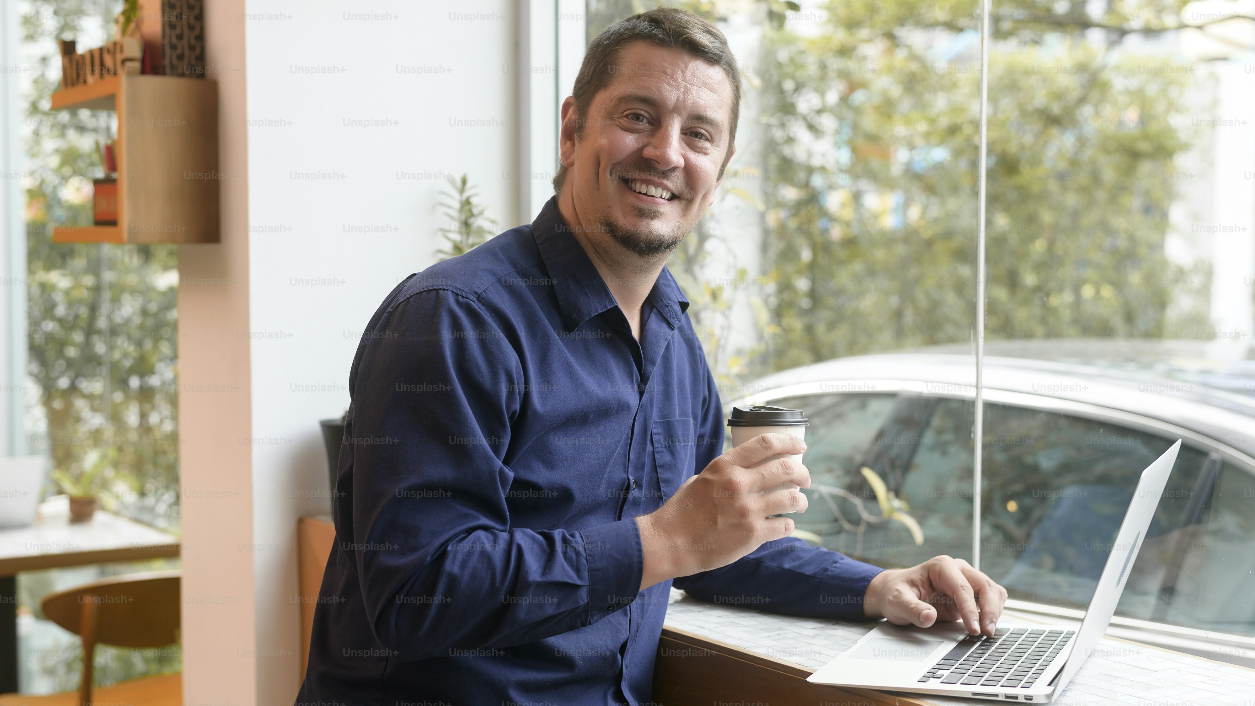 Portrait of business caucasian man in coffee shop