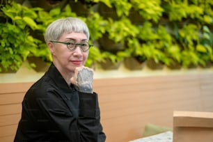 Portrait of senior businesswoman in coffee shop