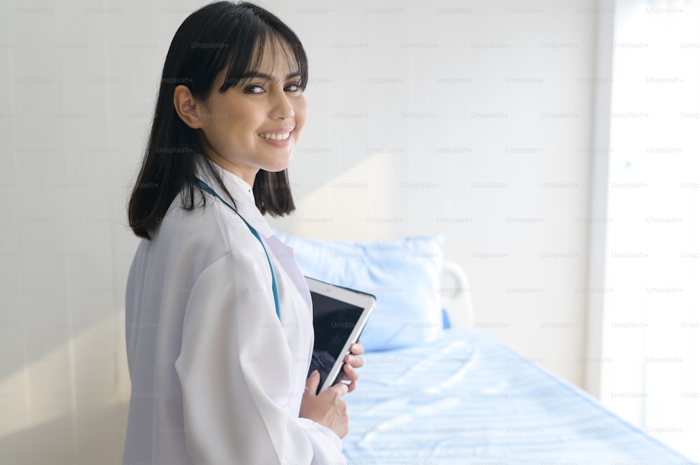 Portrait of young female doctor with stethoscope working at hospital, medical and health care concept