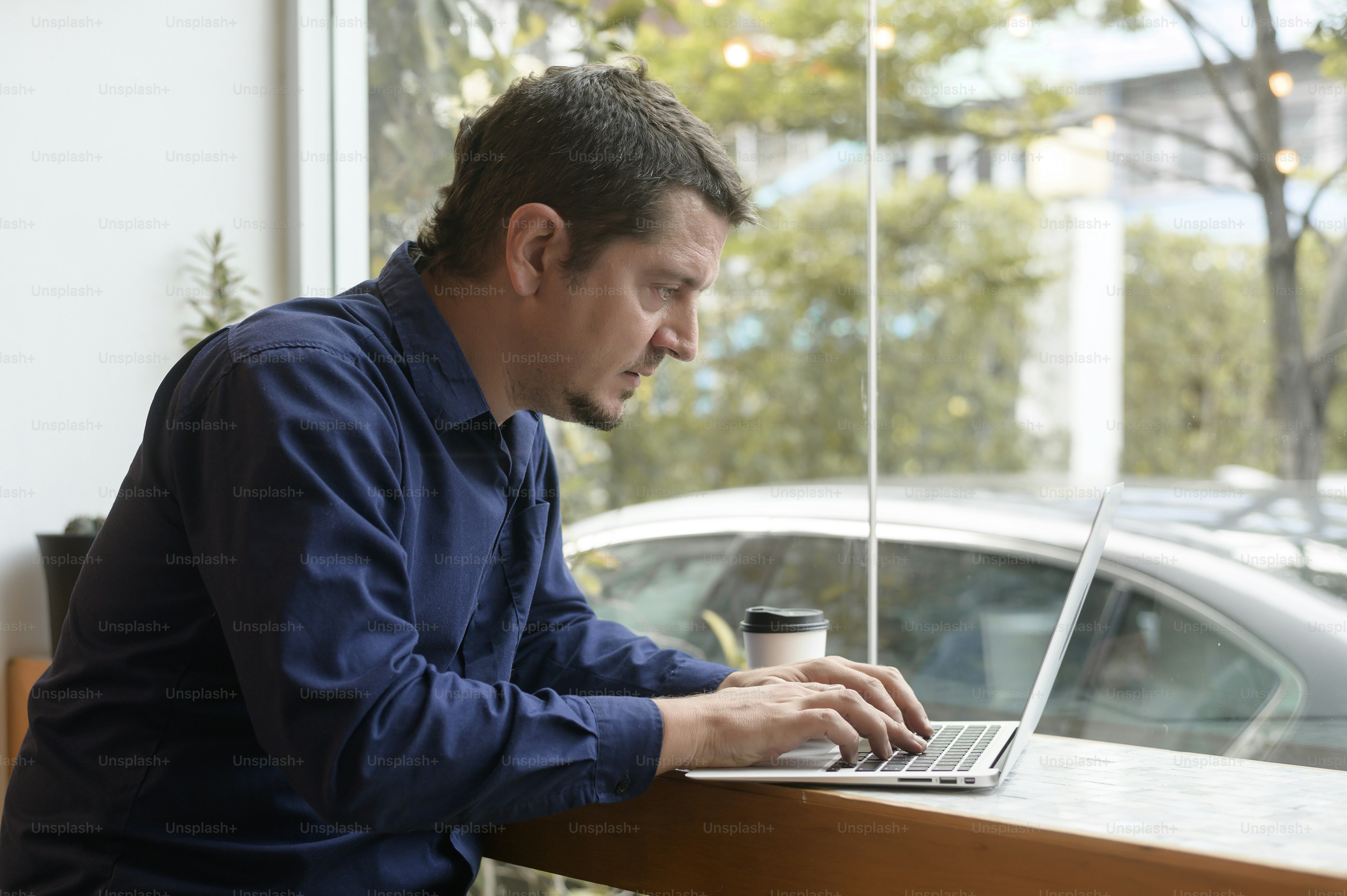 Portrait of business caucasian man in coffee shop