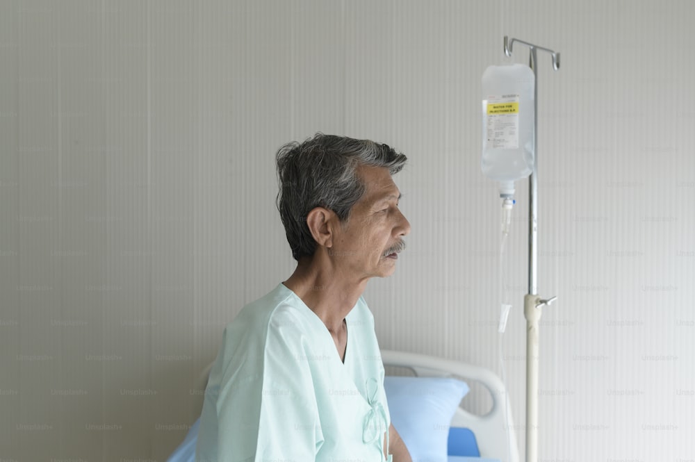 Portrait of senior patient lying on bed in hospital, healthcare and medical concept