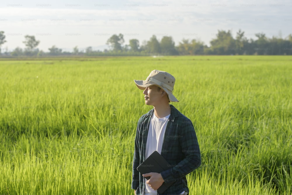 A young female smart farmer with tablet on field,High technology innovations and smart farming