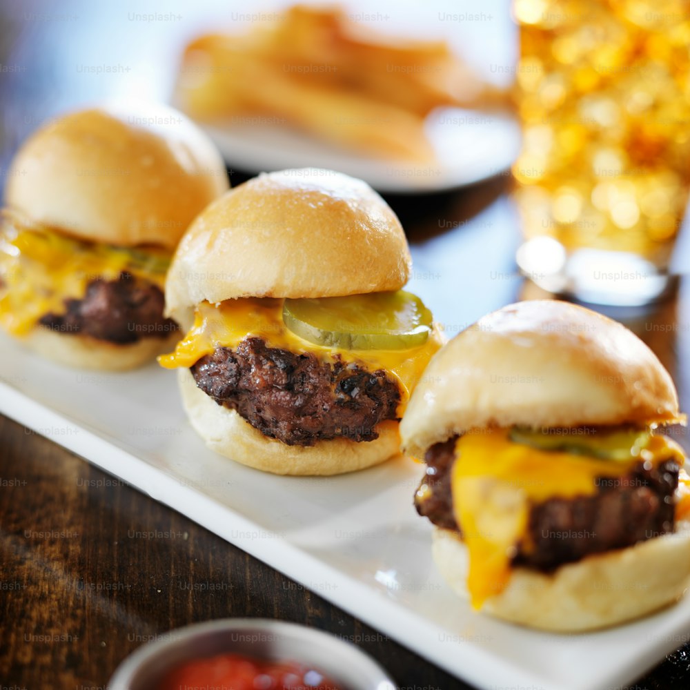 burger sliders with melted cheese and pickle shot close up with selective focus