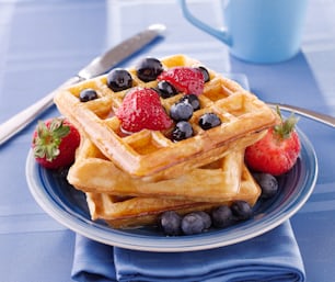 blueberry waffles with strawberries, shot close up with selective focus