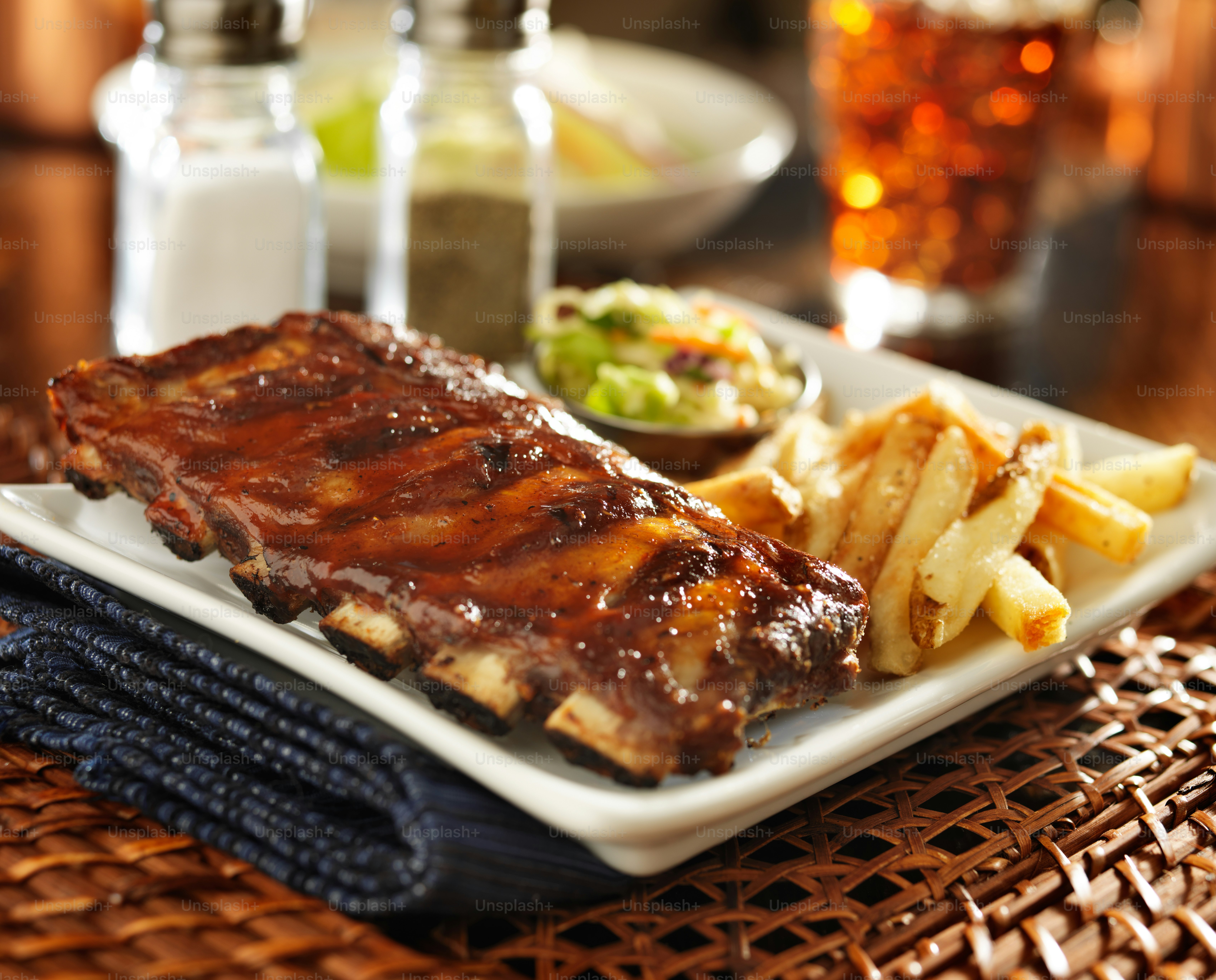 Barbecue rib meal with cole slaw and french fries shot with selective