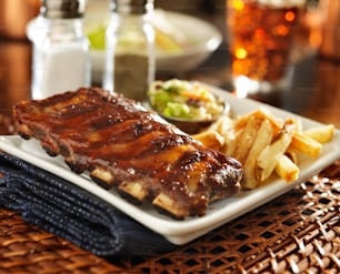 barbecue rib meal with cole slaw and french fries shot with selective focus