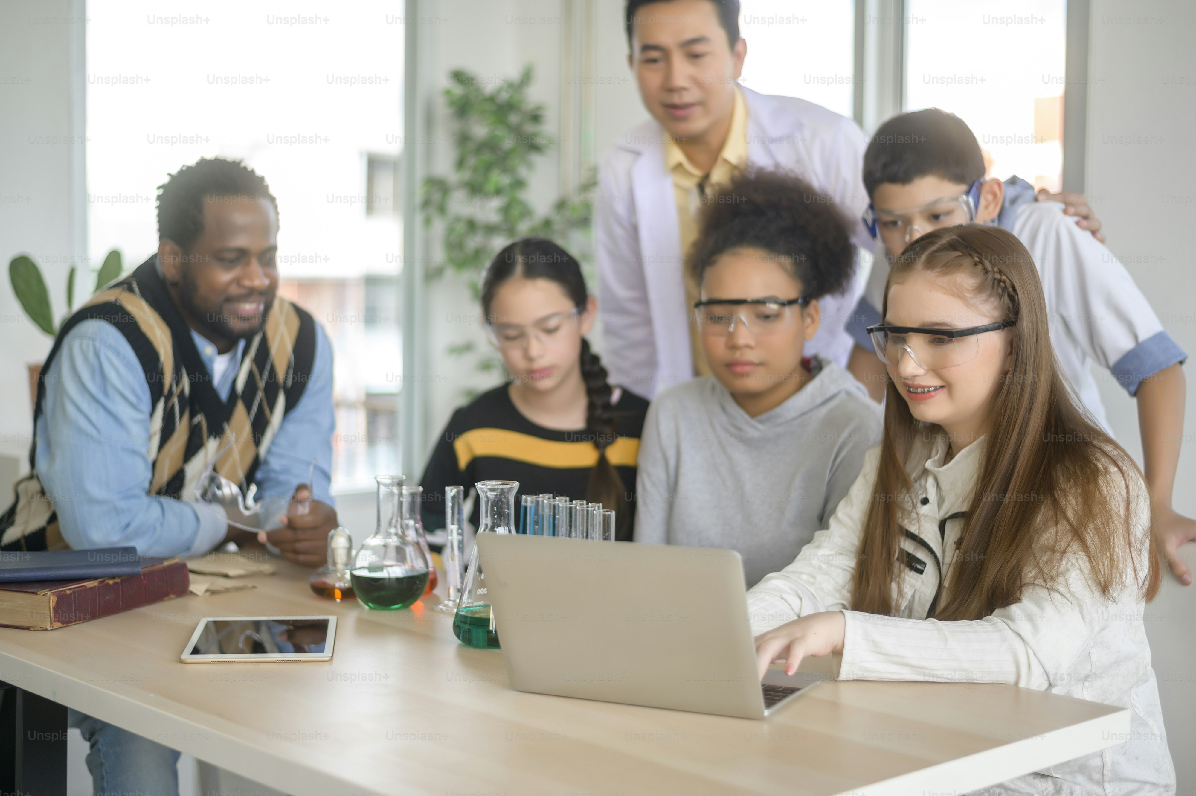 group of students studying and playing with teacher, education and learning concept.