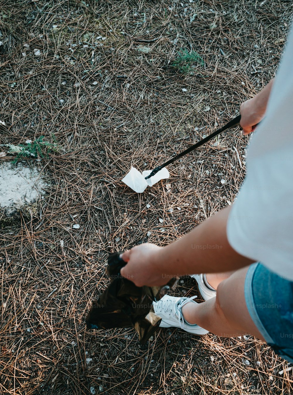 a person holding a black object in their hand