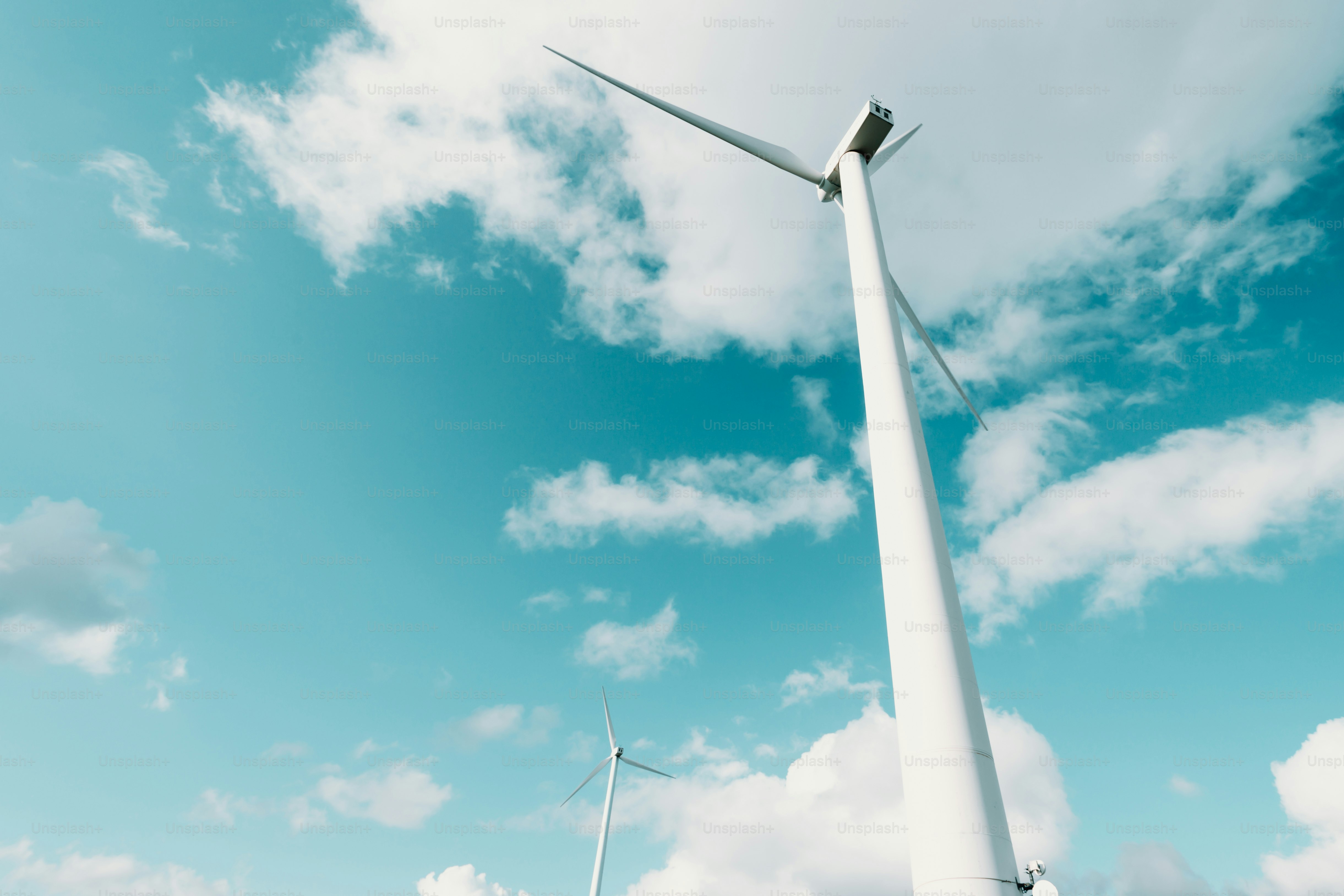 a group of wind turbines on a cloudy day
