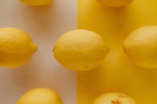a group of lemons sitting next to each other