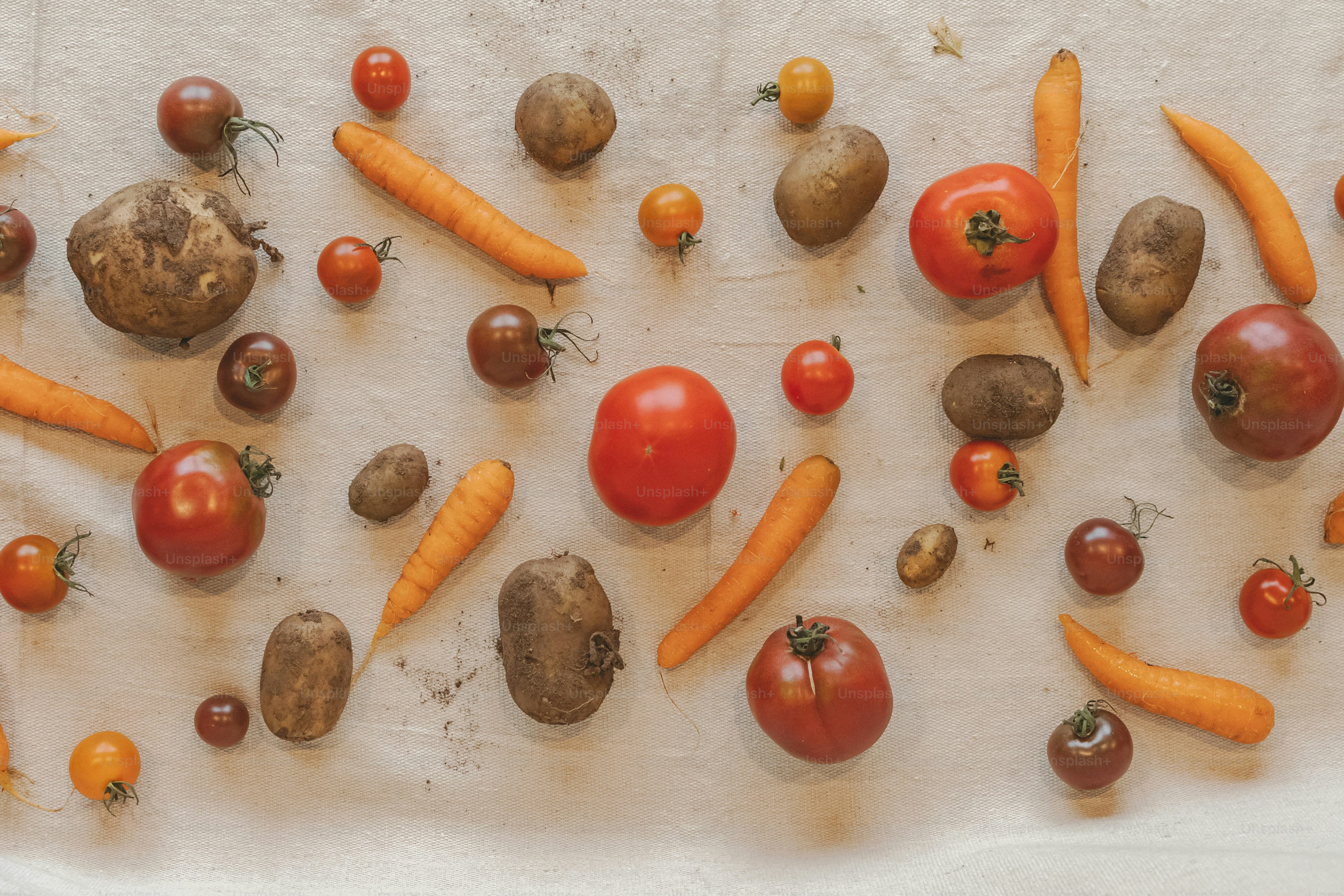 a table topped with lots of different types of vegetables