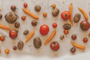 a table topped with lots of different types of vegetables