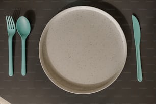 a plate, fork, and knife on a table