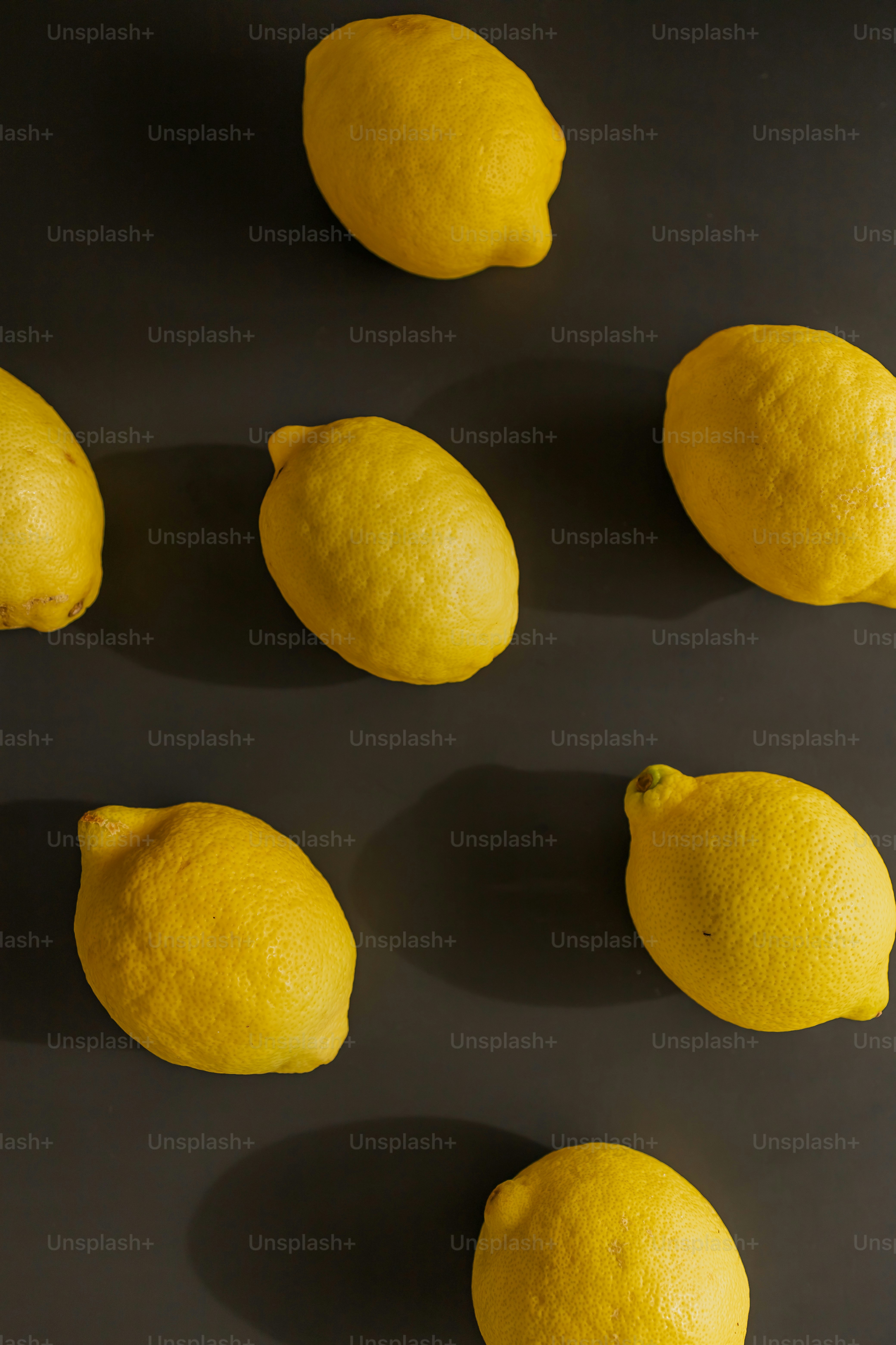 a group of lemons sitting on top of a table
