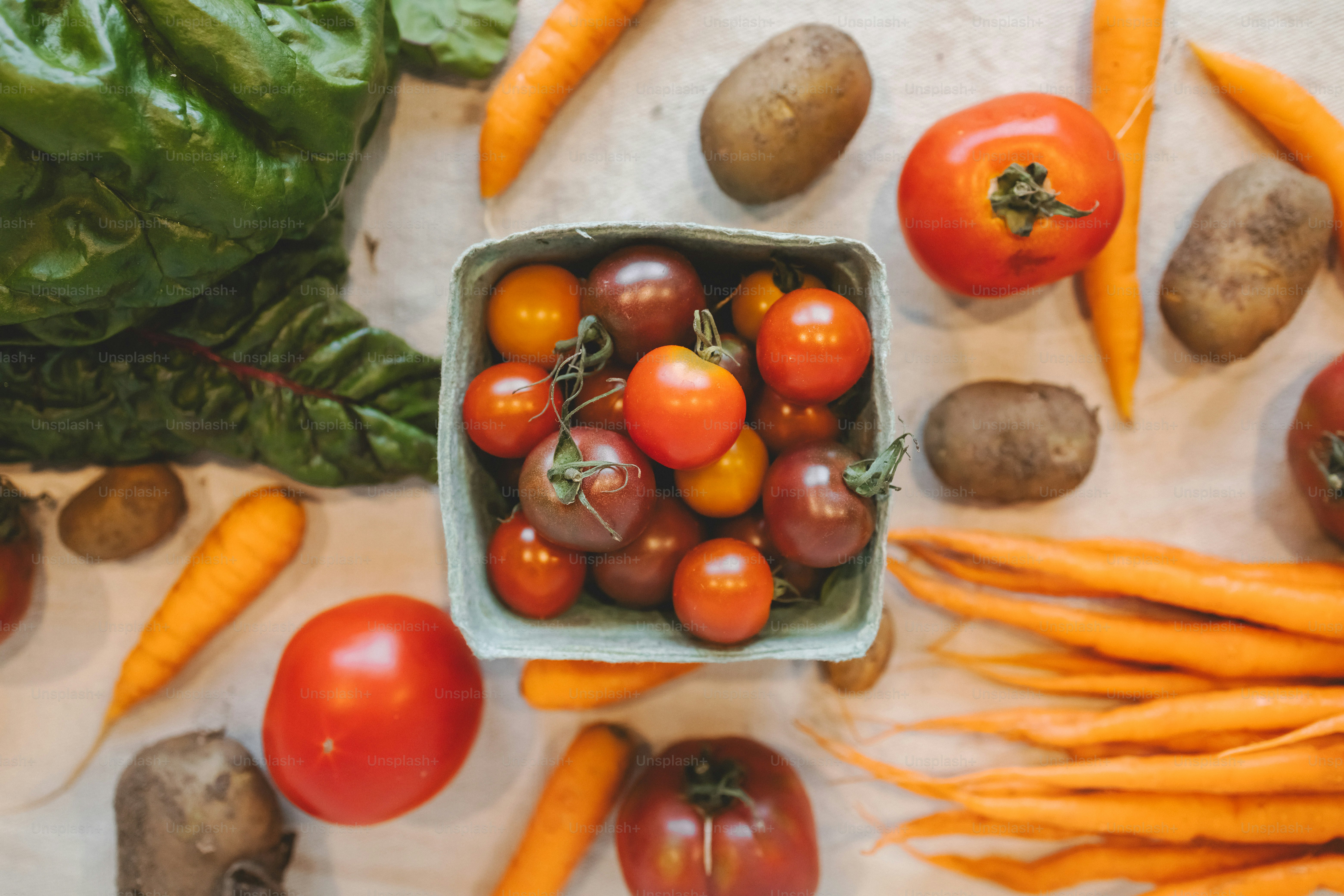 a table topped with lots of different types of vegetables